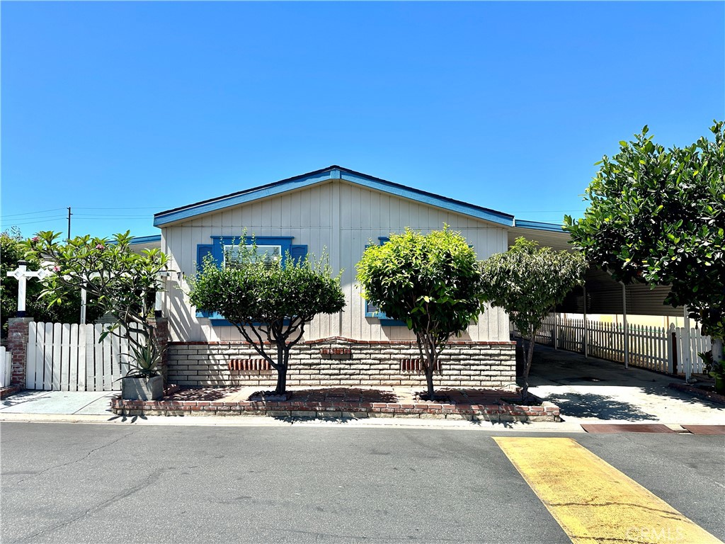 Welcome to this spacious and well-maintained home located in the desirable Sandalwood Mobile Home Park in Santa Ana, right at the border of Westminster, Fountain Valley, and Garden Grove. Offering 4 bedrooms, 2 bathrooms, and 1,307 sq. ft. of living space, this home is perfect for families looking for comfort and convenience. Step inside and be greeted by the high vaulted ceiling that enhances the open layout. The kitchen with a central island flows seamlessly into the bright living room and family room, creating the ideal space for gatherings and everyday living. The master suite features a walk-in closet and an enormous master bathroom, providing a private retreat. Recent upgrades include a new roof (2024) and completed termite work (2024), giving you peace of mind. Outside, enjoy your very own tropical oasis with fruit trees such as plum, custard apple, tangerine, jackfruit, grapefruit, and more. The location is hard to beat — just minutes from Little Saigon, Mile Square Park, Costco, Sam’s Club, Asian markets, restaurants, and entertainment, with easy access to the 22 and 405 freeways. This is the perfect blend of comfort, convenience, and community living!