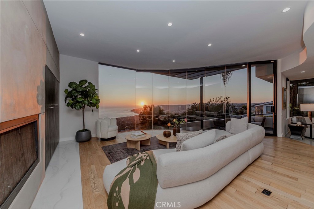 Discover a modern coastal masterpiece by renowned architect Mark Singer. This iconic 4-bedroom, 3-bath residence captures sweeping ocean, sunset, and hillside views from every level. Singer’s signature style shines throughout — seamless indoor-outdoor transitions, sculptural lines, and natural materials that blend effortlessly with the surrounding landscape. The open-concept layout is designed for effortless entertaining, featuring a dramatic main living space with floor-to-ceiling glass and expansive terraces that invite golden-hour gatherings. A true architectural sanctuary, perfectly positioned above Laguna’s vibrant village and beaches, yet offering ultimate privacy. Where architecture meets coastal feel — this is Laguna Beach living at its finest.