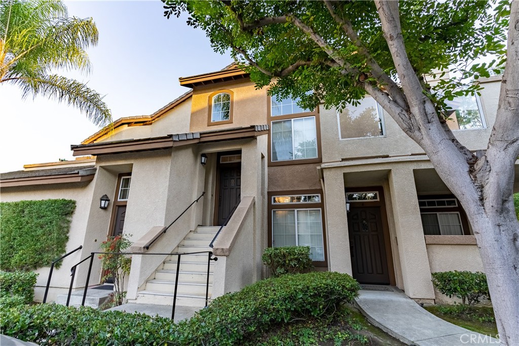 Beautifully Upgraded End-Unit Townhome in Prime Aliso Viejo Location with 2 bedrooms + Loft! This light-filled end-unit townhome offers soaring vaulted ceilings, expansive windows, and an open, airy feel throughout. The home features 2 bedrooms plus a versatile loft (perfect as a 3rd bedroom or home office), 2 remodeled bathrooms, and a direct-access 2-car garage. The remodeled kitchen is a showstopper, complete with a wood accent wall, sleek lacquered cabinets, Corian countertops, a large stainless sink with a restaurant-style faucet, and high-end stainless steel appliances—including a refrigerator, 5-burner stove, microwave, and dishwasher. The spacious dining area, surrounded by floor-to-ceiling windows, flows seamlessly into the inviting family room with a cozy fireplace. The oversized primary suite boasts a walk-in closet and a beautifully remodeled bath featuring dual wall-mount vanities, a soaking tub with custom shower doors, designer lighting, and upgraded flooring. The secondary bathroom has also been tastefully remodeled to match. Additional highlights include a whole-house fan, interior laundry with full-size Maytag Neptune washer and dryer, new blinds throughout, and a large wrap-around balcony—perfect for relaxing or entertaining. The HOA has re-piped the neighborhood, and residents enjoy access to a saltwater pool & spa just a 2-minute walk away, plus a huge adjacent park. This home is in an unbeatable location—walking distance to Starbucks, Trader Joe’s, and Aliso Viejo Town Center, with quick access to the 73 Toll Road.