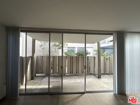 Photo of 833 Moraga Drive #6, Los Angeles, CA 90049 (MLS # 25618929)