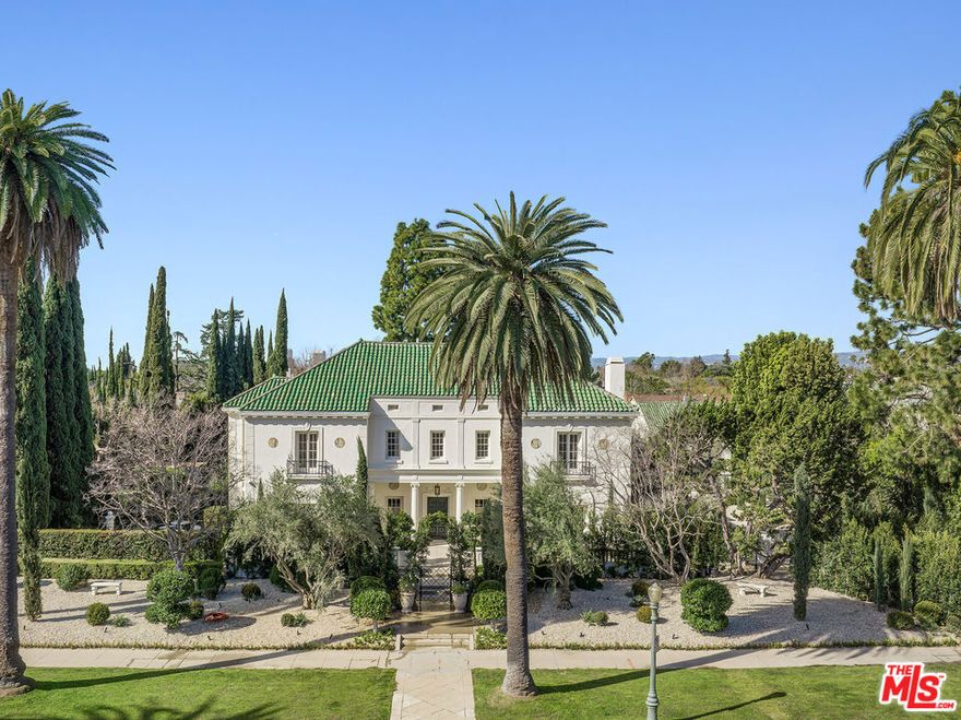 VILLA VENDOME |1917, Frank Meline,  Italian Renaissance Villa In The Palladian style expanded to approx 11,000 SF, on a massive 3/4 acre lot. Meticulously updated inside & out by Plus Development & AD100's Jake Arnold in a highly bespoke style with an extraordinary aesthetic; retaining much of the original detail but thoroughly bringing it up to contemporary standards in design & functionality with superb execution. One of a kind compound with large side motor court, multiple structures - gym, garage, guesthouse with a 75' swimmers pool & spa. The main floor with 12 & 13 foot ceilings consists of a large foyer - featuring Breccia de Vendome marble casements, limestone floors, formal living room with fireplace, original crown molding, french doors, library with bleached mahogany bookcases, the home office with original paneled walls and french doors to a private garden. Kitchen banquet  is fully equipped with LaCanche restaurant-grade gas stove/ovens, secondary chefs-grade kitchen adjacent. Step down into the grand scale dining room with a double facing fireplace separating the sun room, a favorite room for many with 3 window walls looking into the rear garden, equipped with auto shades. Second floor with 5 fully ensuite bedrooms - the primary bedroom is located at the western wing taking full advantage of the rear garden exposure - automated window coverings, fireplace, art TV and large patio overlooking the massive grassy rear yard. 3rd level is a flexible space perfect as a suite or playroom with a secret sleeping/reading loft, full bathroom and additional storage. The cinema and adjacent speakeasy are located on the lower level with another powder room, laundry facilities and more storage. Outside off the motor court is a 2 car garage, Pool bath, second floor fully self contained Guest Apartment and a separate gym overlooking the pool. On the south side is the outdoor dining lanai, firepit and spa.