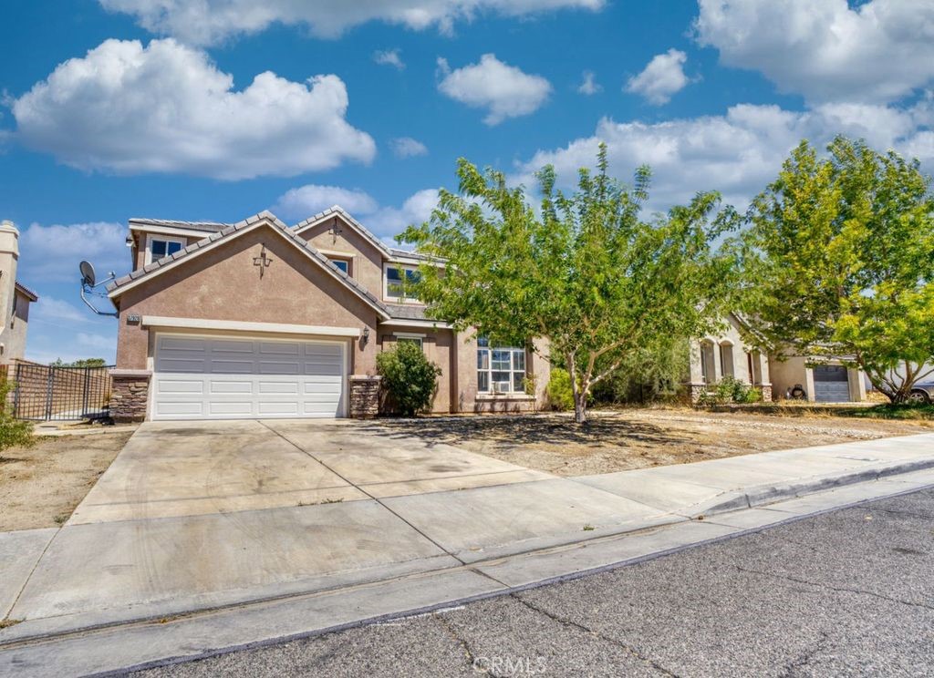 Step into space, style, and comfort in this stunning 7-bedroom remodeled home located in the heart of Palmdale. Tucked away in a quiet neighborhood, this property offers the perfect blend of peaceful living and city convenience. Just minutes from popular shopping centers, dining, and local amenities, the location couldn't be better. Inside, you'll find laminate flooring throughout, giving the home a clean, modern feel. The new carpet on the elegant spiral staircase adds warmth and style as it leads you to the upper level. Recessed lighting fills the interior with soft, energy-efficient light, highlighting every updated detail throughout the home. Whether you're relaxing, hosting, or working from home, this home offers room for everything and everyone. Each bedroom is generously sized, making it easy to create multiple living spaces, offices, or hobby rooms. The open floor plan gives the home a light and airy feel, while the tasteful updates make it move-in ready. This rare, oversized home is ready for new memories. Don't miss your chance to own one of Palmdale's most unique and spacious properties in a truly prime location. Seller Financing and Rent to Own Options! Give us a call today and schedule your private showing.