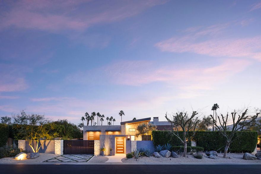 Welcome to ''The Lodge'' at 48750 Avenida El Nido in La Quinta, CA--a desert retreat where modern luxury meets effortless comfort. With its smart design and inviting vibe, this home offers the ultimate blend of sophistication and relaxation.Step inside and be greeted by soaring ceilings and an abundance of natural light that creates an open, airy feel throughout the living spaces. The chef's kitchen, complete with a fully-stocked interior bar, is an entertainer's dream, while the in-law suite--with its own full kitchen, washer, and dryer--offers the perfect setup for extended stays or multi-generational living.Outside, the property truly shines. The wrap-around patios showcase breathtaking south and west-facing mountain views and lead to a raised pool, hot tub, and tanning platform. A backyard putting green awaits for golf enthusiasts, while multiple firepits, a lounge area, and citrus trees add to the resort-like ambiance. Whether you're hosting a lively gathering or enjoying a peaceful moment under the stars, this outdoor space is designed to impress.The primary suite is a private haven, featuring a soaking tub, shower, fireplace, and a walk-in closet complete with a charming library ladder. Guest rooms are thoughtfully arranged to provide comfort and privacy, making this home ideal for hosting friends and family. Every detail has been carefully considered, from the 15-foot Fleetwood sliders and limestone tiles to the dramatic torch sconces and cascading waterfall at the entryway. There's even a poolside bathroom for ultimate convenience. ''The Lodge'' isn't just a home--it's a lifestyle. Here, you'll experience the best of desert living, all within a setting designed to inspire and relax. Ready to make Luxury a part of your La Quinta lifestyle?