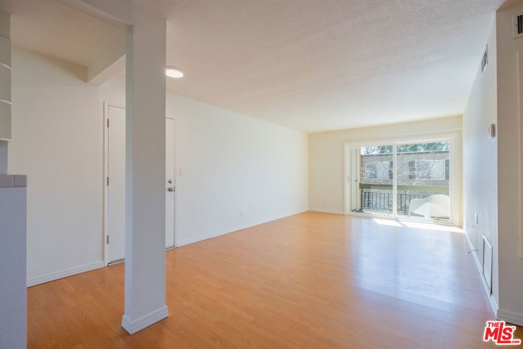 Whether looking to move into a quiet community which offers many amenities or looking for an investment/income property, this beautifully maintained and recently painted 2-bedroom, 2-bathroom upper-level condo in Valencia Lakeshore offers a bright and inviting living space with privacy, high ceilings, and two balconies situated on opposite sides allowing for fresh breezeway. The open-concept layout flows seamlessly from the spacious living area to a well-appointed kitchen with ample cabinetry, farmhouse sink, and wood and tile countertops, creating a warm and functional cooking space. The bedrooms are spacious and filled with natural light from the updated windows, featuring stylish ceiling fans and custom storage solutions. The primary suite offers ample closet space and an en-suite bathroom, while the additional bedroom is perfect for guests or a home office. Enjoy complete privacy on one balcony surrounded by lush greenery, an ideal spot for morning coffee or an evening barbecue. Residents have access to resort-style amenities, including two pools, tennis and paddle tennis courts, basketball half-courts, a kid's playground, a picnic area, a dog park, a BBQ area, and a clubhouse. Located adjacent to California Institute of the Arts (CalArts) and Vista Valencia Golf Course, this community also offers easy access to shopping, dining, entertainment, and major freeways.