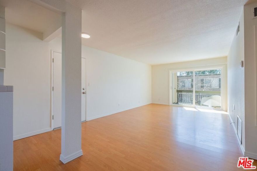 Whether looking to move into a quiet community which offers many amenities or looking for an investment/income property, this beautifully maintained and recently painted 2-bedroom, 2-bathroom upper-level condo in Valencia Lakeshore offers a bright and inviting living space with privacy, high ceilings, and two balconies situated on opposite sides allowing for fresh breezeway. The open-concept layout flows seamlessly from the spacious living area to a well-appointed kitchen with ample cabinetry, farmhouse sink, and wood and tile countertops, creating a warm and functional cooking space. The bedrooms are spacious and filled with natural light from the updated windows, featuring stylish ceiling fans and custom storage solutions. The primary suite offers ample closet space and an en-suite bathroom, while the additional bedroom is perfect for guests or a home office.  Enjoy complete privacy on one balcony surrounded by lush greenery, an ideal spot for morning coffee or an evening barbecue. Residents have access to resort-style amenities, including two pools, tennis and paddle tennis courts, basketball half-courts, a kid's playground, a picnic area, a dog park, a BBQ area, and a clubhouse. Located adjacent to California Institute of the Arts (CalArts) and Vista Valencia Golf Course, this community also offers easy access to shopping, dining, entertainment, and major freeways.