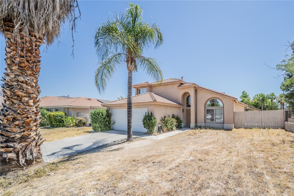 Welcome to your dream pool home nestled on a private corner lot at the end of a peaceful cul-de-sac, just steps from a scenic community trail.
This beautifully updated residence offers 4 bedrooms, 3 full baths, and 1,839 sq ft of thoughtfully designed living space on a generous 7,405 sq ft lot. Perfect for multi-generational living or guest stays, the highly sought-after first-floor bedroom and full bath provide flexibility and convenience. Step inside to soaring two-story ceilings and an abundance of natural light streaming through high windows. The open living and dining area features striking vaulted ceilings, creating a warm and airy atmosphere ideal for entertaining. The updated kitchen boasts freshly painted cabinetry, granite countertops, a stylish tile backsplash, recessed lighting, and brand-new stainless steel appliances—all open to a cozy family room with a fireplace and custom built-in cabinetry. The first floor features matching tile flooring throughout, while the downstairs bedroom has brand-new carpeting. Upstairs, you’ll find three additional bedrooms and two full baths, including a spacious primary suite with vaulted ceilings, double-door entry to a private balcony overlooking the sparkling pool, dual closets, and a skylit en-suite bath with dual sinks and a tub/shower combo. Additional highlights include fresh interior and exterior paint, and new carpeting. Best of all, enjoy low taxes and no HOA fees, making this home as affordable as it is stunning. on’t miss the opportunity to make this move-in-ready gem your own!