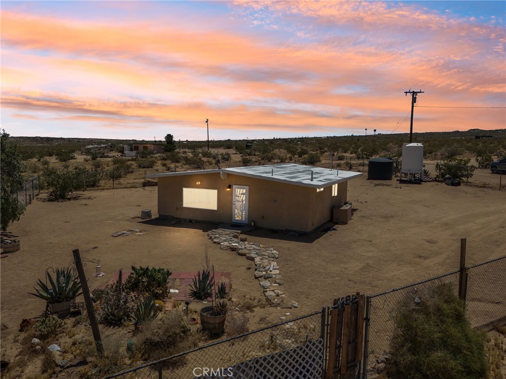 Looking for a comfortable home or an incredible investment opportunity in a fantastic Johnson Valley location? This delightful cabin-turned-home might be what you’re searching for! Step inside a bright, open-concept interior finished in crisp white tones, canned lighting, and concrete flooring. Abundant natural light streams through two expansive picture windows, lending a vibrant atmosphere as you relax or entertain. Newer stainless-steel appliances, ample cabinetry, gleaming countertops, and amazing desert views greet you in the kitchen. Two restful bedrooms offer a serene escape after a long day, both fitted with ceiling fans and generous storage. A refreshing shared bath with a step-in shower accommodates both guests and residents. Outside, you’ll have a gated yard within the extensive outdoor area ready for enjoying leisurely activities like camping and s’mores under the stars. Additional features are the mini dual heat & air system and three RV electric hook-ups. With shopping, dining, golf, Big Bear, Palm Springs, the airport, and Joshua National Tree close by, why wait? Not to mention the Hammer Race that happens annually.