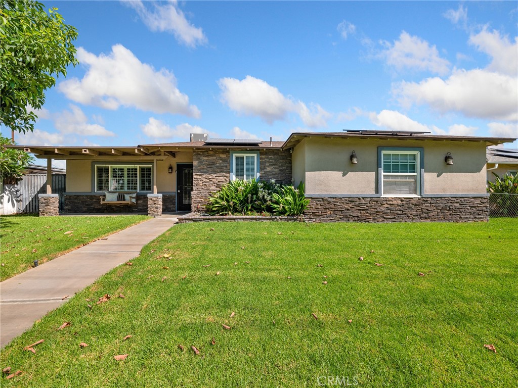 Welcome to this beautifully remodeled 3-bedroom, 2-bath home in Rialto, offering 1,156 sq. ft. of living space on a landscaped 7,300 sq. ft. lot. The exterior features a mature avocado tree, welcoming porch, flagstone accents, and atrium-style front door. Electric driveway gates with alley access, security cameras, exterior lighting, sprinkler system, an 18x26 carport, two-car attached garage, and storage shed provide both convenience and security. Major updates include a newer roof, a 2023 HVAC system, upgraded plumbing from the main line to the kitchen and baths, and a 2019 water heater. A leased solar system offers energy efficiency.
Inside, the home is move-in ready with fresh paint, crown molding, new windows, plantation shutters, tile flooring in living areas, and laminate in bedrooms. The living room is wired for surround sound, and every room has USB outlets. The kitchen features granite countertops, stainless steel appliances, a farmhouse sink, and a custom dining nook with built-in bench and shelving. The primary suite offers two closets and a spa-style bath with custom tile shower and glass doors. The guest bath includes granite counters, pedestal sink, and walk-in shower. Secondary bedrooms are stylish, with one showcasing a New York City firehouse vibe with brick accent wall, sliding barn door, and sconce lighting.
Additional highlights include hallway storage, ceiling fans throughout, a Nest thermostat, and garage cabinetry with washer and dryer hookups. The backyard is private with block wall and wood fencing, offering plenty of outdoor living space.
Located just three miles from Kaiser Permanente, one mile from Arrowhead Trauma Center, and within two miles of all local schools, this turnkey home also offers easy access to shopping, dining, and freeways. Comparable to newer builds but filled with thoughtful upgrades, this Rialto gem is ready for its next owner.