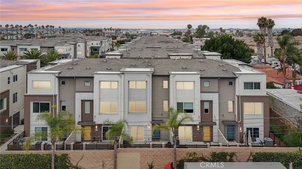 Welcome to 14033 Zirconia Ln #3, a beautifully designed, newer-construction townhome located in the gated and charming Stonefield community of Gardena. Built in 2022. This tri-level residence offers approximately 1,800 square feet of thoughtfully planned living space, featuring 3 spacious bedrooms—each with its own private full bathroom—and a convenient half bath for guests. The ground-floor bedroom is perfect for guests, a home office, or multi-generational living, with direct access to a cozy patio. On the main level, enjoy an open-concept layout with a bright and airy living area that flows seamlessly into the gourmet kitchen, complete with quartz countertops, a large island, a walk-in pantry, shaker-style cabinetry, and Whirlpool stainless steel appliances. Upstairs, you'll find two more bedroom suites, including the spacious primary retreat. Modern laminate flooring, recessed lighting, central HVAC, and an attached two-car garage with direct access add comfort and convenience. The community is quiet, safe, pet-friendly, and offers guest parking. Ideally situated near the 110 and 91 freeways, this home provides easy access to LAX, shopping, restaurants, schools, parks, and public transit—making it a commuter’s dream. Priced right and offering outstanding value, this is a rare opportunity to own a move-in-ready modern home in a highly desirable location.