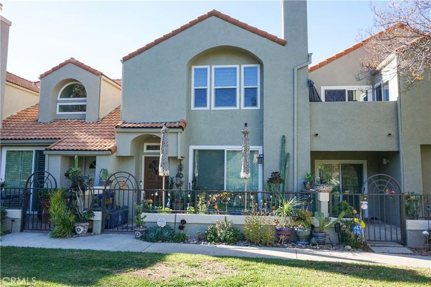 You must come check out this gorgeous townhouse! Located in the very best area of Cal West, this home faces a lush meadow, surrounded by trees, rocks and the majestic Santa Susana Mountains. Almost every inch has been remodeled with particular attention to all the details, beginning with the amazing front patio, filled with colorful tiled planters, benches and even a fountain to enhance your peaceful relaxing haven. An abundance of natural light welcomes you into the living room, with its cozy fireplace, and dining area with soaring ceiling and skylight. The kitchen sparkles with elegance with its granite counters, big SS sink, built-in microwave, newer refrigerator and breakfast bar that looks out to the living room. The laundry area is downstairs, as is the exquisite guest bathroom. Upstairs there are 2 primary suites, one with a walk-in closet and the other with a large sitting area, both with their own ravishing bathroom with jetted bathtubs. The 2-car garage has direct access into the home. Cal West is a well-maintained complex with 2 pools, spas, BBQ and cooking areas, close to the 118 freeway and minutes away from Porter Ranch and  Simi Valley.