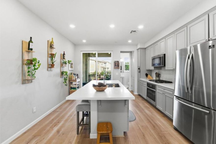 Per CNN, the FED just cut rates for the 2nd time (on 10/29/25) to its lowest level in 3 years, lowering their benchmark lending rate to a range between 3.75% & 4%. Timing is everything! A beautifully maintained newer Milpitas townhome built to ENERGY STAR & Build It Green guidelines, offering comfort, efficiency & modern style. The open-concept design features soaring 9-foot ceilings, abundant natural light, and a chefs kitchen w/ solid stone counters, stainless steel appliances (including a brand new oven), gas cooktop, & a huge island perfect for entertaining. Start your day with the warmth of the morning sun and a cup of coffee on the covered East-facing balcony that overlooks the entire neighborhood; perfect for unwinding after a long day at the office. Upstairs, 2 ensuite bedrooms include walk-in closets and upgraded baths, with a convenient laundry area nearby. The attached oversized 2-car garage provides ample storage & EV-ready power. Community amenities include 2 parks, playgrounds & BBQ areas. Families will love the top-rated Milpitas schools Joseph Weller Elem (7/9), Thomas Russell Mid (8/10) & Milpitas High (9/9). Check out model match sales @ 1090 California Cir ($918K: 8/28/25) & 398 Desert Holly ($919K: 10/20/25) . Walking distance to Shirdi Sai Parivar/BAPS Mandir