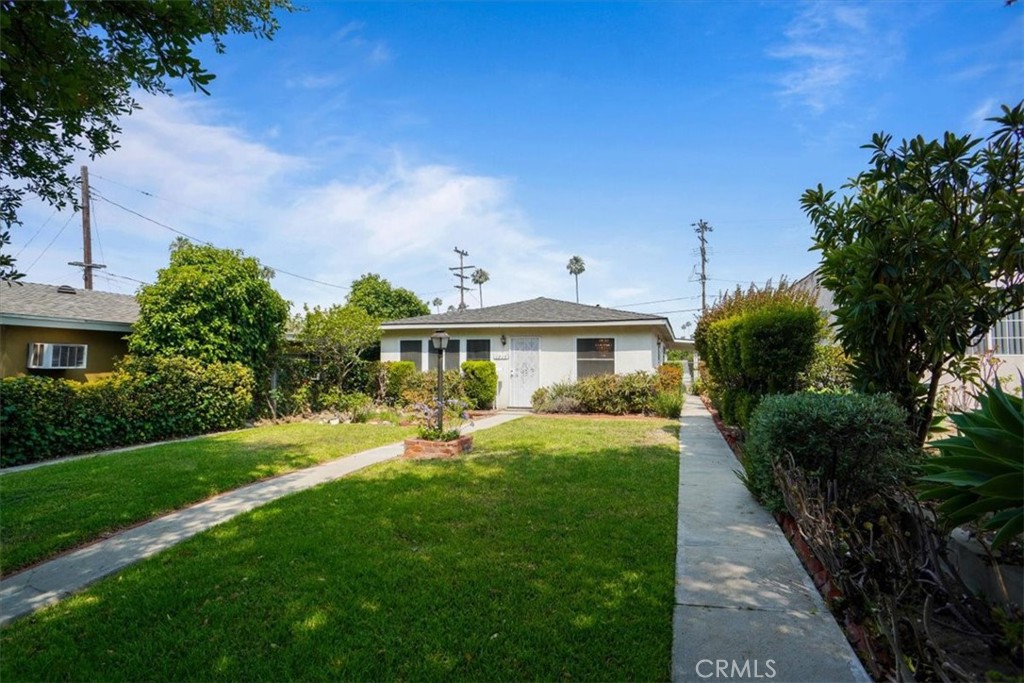 Northwest Glendale home on the market for the first time in over 50 years! Its versatile floorplan allows the home to be used as a single family residence or easily converted into multiple dwellings. Built in 1946, it includes 4 bedrooms, 1.75 bathrooms, family room, bonus room, 1,808 square feet of living space and 6,649 square foot lot. The living area is spacious in size and is highlighted by its bank of windows that overlook the front yard. The adjacent dining area is open to the kitchen and perfect for entertaining family and friends. The kitchen includes Oak cabinets, solid surface countertop and tile flooring. The front bedrooms are generous in size and are serviced by the full bathroom. Travel to the rear of the home to find the comfortable family room with a wood beamed ceiling, knotty pine paneling and a decorative fireplace. The rear foyer has its own entrance and is the central area in the rear portion of the home. The bonus room is the ideal space for an office, nursery or play room. The rear bedrooms are generous in size and are serviced by the ¾ bathroom. The backyard contains a covered patio, carport with alley access to store multiple cars and a garden area. Additional features include central air/heat and a utility room with washer & dryer hook ups. Don’t miss this opportunity to reimagine this home and make it your own!
