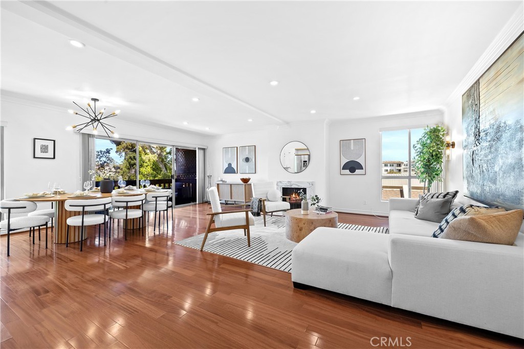 Stylish Single-Level Top-Floor End Unit in Prime Sherman Oaks—Feels Like a New York Loft! Nearly 1,500 Sq Ft! The Interior Design is centered on a Central Great Room encompassing the Living Room, Dining Area, and Kitchen, making it a great place to Relax and Entertain in a Modern and Comfortable Setting. Living Room & Dining Area boast Hardwood Floors, Recessed LED Lights, a Cozy Fireplace, and Sliders to a Balcony Overlooking the Rear Grounds and Sparkling Pool—a Rare View shared by only two units in the Complex. The Bright Chef’s Kitchen Features Stainless Steel Appliances, a Breakfast/Buffet Bar, and Plenty of Storage. The Spacious and Serene Primary Suite includes a Spa-like Bath and a Huge Walk-In Closet with Built-ins. Secondary Bedroom and Bathroom have been designed with Neutral Colors and Décor. Stackable Washer and Dryer are located in the Laundry Closet. Amenities Include a Pool, Spa, BBQs, Large Recreation Room for Pool Parties, and His/Hers Saunas. HOA Covers Water, Insurance, Earthquake Insurance, Trash, and All Common Area Maintenance. Gated Parking with 2 Tandem Assigned Parking Spaces and Storage. Walking distance to the Highly Rated Kester Elementary. Just minutes to the 101/405 Freeways and Restaurants on Ventura Blvd. A Rare Find Combining Style, Space, and Convenience!