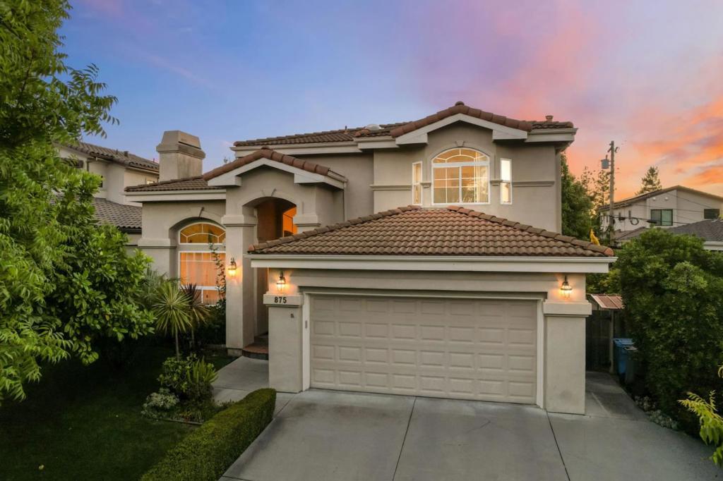 Discover the pinnacle of sophisticated living in this stunning custom-built modern 4BR/3BA home in a quiet, highly desirable Cupertino neighborhood with Top-Rated schools. You will be welcomed by a grand marble entry with an elegant chandelier and skylight leading to soaring 14ft. ceilings in the living and dining rooms. The open-concept Gourmet Chef's kitchen impresses with a striking central island, sleek granite countertops, garden window and top-of-the-line Miele, Thermador, and Bosch appliances - creating an ideal setting for both everyday living and elegant entertaining. Step outside through elegant French doors into your own private backyard sanctuary, framed by mature fruit trees and meticulously manicured gardens. Enjoy 2 separate slate stone patios - perfect settings for alfresco dining, morning coffee, or peaceful moments in nature. The luxurious primary suite includes a walk-in closet and spa-style bath with double jacuzzi tub and marble floors. Additional highlights include 1 bedroom on 1st floor, 2 fireplaces, curved staircase with skylight, built-in custom cabinetry throughout, an EV charger, and 2-car garage. An enviable address mere minutes from Apple Park, Nvidia HQ and leading Silicon Valley employers, delivering the ultimate blend of convenience and lifestyle!