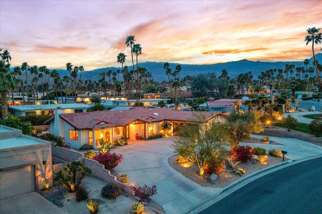 Discover Silver Spur Ranch--an enclave of unique homes nestled in South Palm Desert. THIS designer-furnished, exquisitely updated home is on an upper lot with unobstructed Southern Mountain views. Property combines vintage class with modern comforts. Sweeping circular drive sets the stage. Tiled courtyard entry. Double art glass doors open to reveal a showplace. Soaring vaulted ceiling with wood beam accent. Spacious open floor plan. Updated features throughout. Exceptional attention to detail modernizing entire property with great care, while showing respect towards its original Spanish revival core elements. Gourmet kitchen with new appliances, including floating hood vent over range, tons of countertop & cabinetry space, new backsplash. Barn door into kitchen. New fireplace tile, mantel, gas logs, rock & screen. Luxury vinyl floors in all main areas, carpeted bedrooms. Fresh interior paint. New fixtures, finishes, handles & pulls. Well-spaced bedrooms for privacy. Expansive Primary suite with spa-like bath--soaking tub, dual vanities, separate shower, oversized sized walk-in closet spaces! Sliders glide open to resort-like backyard. Sparkling pool with waterfall spa. Extended covered patio with built-in BBQ. Glorious, draped daybed to relax and enjoy desert vistas from. Hardscape enhanced by faux turf. Raised planters with mature landscape--even citrus trees! All new irrigation system, lighting and accent plants. Updated alarm system. Newly installed high-efficiency solar system. 2-Car attached garage + additional side drive for added parking. Enjoy the gorgeous interior, lounge poolside, entertain, stargaze--this is the IDEAL renovated property to call HOME! Centrally located, mere minutes from El Paseo shopping & dining, neighborhood hiking trails, The Living Desert, tennis clubs and multiple golf courses to choose from all minutes away! Furnished per inventory. Update/renovation list available upon request. Stop searching & START living!