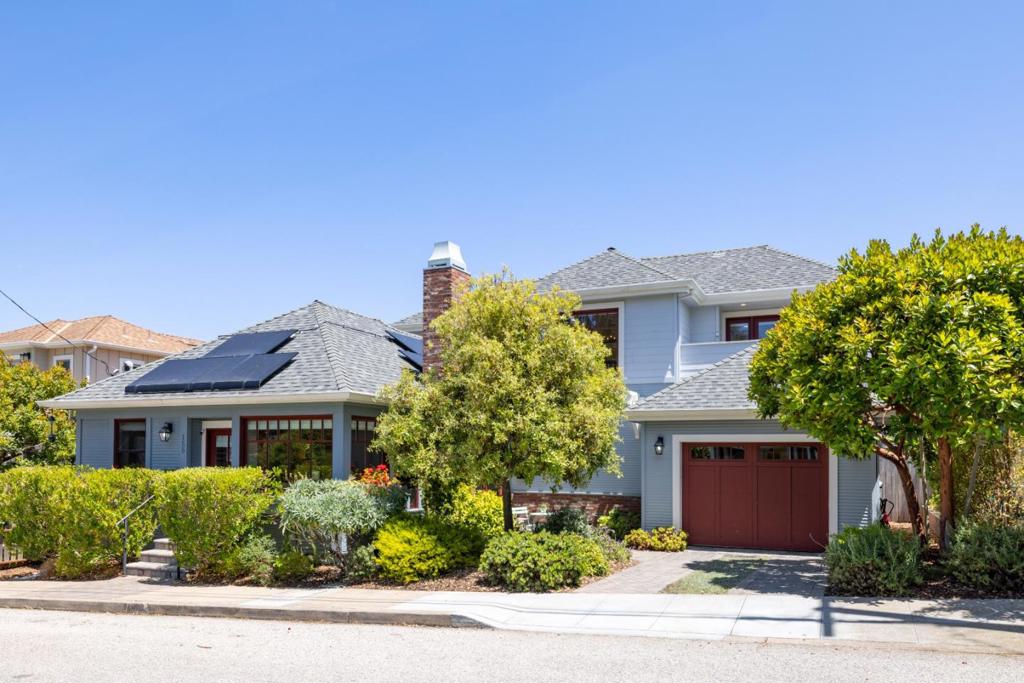 If Goldilocks wanted a home in Pacific Grove, she would surely choose this one. From its central location and tranquil feel to its flexible layout and deluxe finishes, everything about this turn-key treasure is "just right." Situated on a quiet, one-way street just half a block from downtown PG and fewer than two blocks from the Monterey Coastal Recreation Trail, here is a delightful property offering that oh-so-rare combination of total privacy and total proximity. Inside, relax in sun-drenched rooms, including an expansive open living room with high-ceilings, custom Roman shades, a smart fireplace, and seamless access to a truly exceptional gourmet kitchen. Pulling up to sip her porridge on pristine marble countertops, Goldilocks couldn't possibly offer anything less than her wholehearted approval of the top-notch appliances and amenities that are yours to discover and enjoy here, including a six-burner stainless steel Wolf range. At bedtime, while you wind down in your ground level primary suite, your guests and family members can have their pick of two additional bedrooms upstairs, one of which has a spacious balcony from which to fully appreciate your spot in this lovely neighborhood. Don't settle for less than your own fairytale ending. Here, you really can have it all!