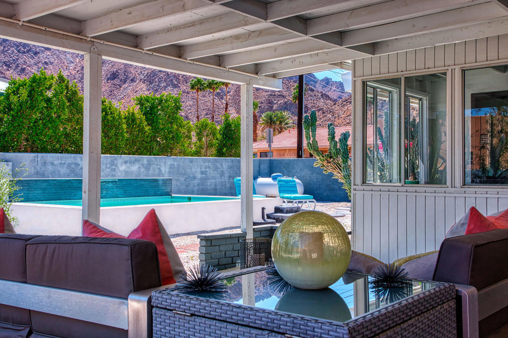 Location, Location, Vacation! Welcome to Casabella, a SEXY Mid-Century Home w/Modern Flair Perched on a DOUBLE CORNER Lot with a Fully Equipped Detached GUEST HOUSE. Move-in Ready, HIGH in the Cove with Jaw Dropping Views of the Santa Rosa Mountains, the Floor Plan is Everything Today's Buyers Covet: BRIGHT and OPEN w/an Abundance of Natural Light. You'll Appreciate the Functional Floor Plan, the Neutral Color Schematic, a Generous Kitchen with a Quartz Island, a Versatile Room w/Murphy Bed, and Spacious Grounds w/a Private SPOOL. The Attached Guest House has a Bedroom, a Full Bath, Living Room, Functional Kitchen and a Separate Entrance, a Rare Feature for the LQ Cove. Other Notable Features are an Outdoor Shower and Numerous Conversation Areas Throughout, for Outdoor Enjoyment Amongst the Views. TURNKEY FURNISHED and Truly a Triple Option of Opportunity; a Primary Residence, a Vacation Getaway -or- a Fantastic Rental Opportunity that could be Ready for Revenue! BONUS: No HOA's, Close to Hiking/Biking Trails & Minutes from Shopping and Dining in Old Town, Golfing, the Polo/Concert Grounds and all that the Desert has to Offer!