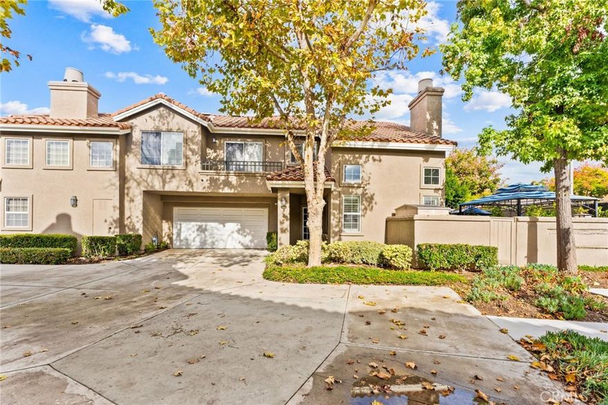 Welcome to this beautifully upgraded corner-unit townhome with no one above or below, offering 2 bedrooms, 1.5 baths, and 1,114 sq ft of thoughtfully designed living space. Located just steps from O’Neill Regional Park, this home blends modern comfort with the natural beauty of one of RSM’s most scenic areas.

The inviting living room features a cozy fireplace, cathedral ceilings, and abundant natural light, creating a warm and open atmosphere the moment you step inside.

The fully remodeled kitchen includes all-new stainless steel appliances, an oversized sink, Lanbo dual-zone wine fridge, custom cabinetry with an oversized pull-out pantry, granite countertops, subway tile backsplash, under-cabinet lighting, and a custom stemware wine rack.

Additional upgrades include new wood shutters, custom paint, recessed lighting on the Lutron Caseta smart system, Nest thermostat and smoke alarms, and stylish metal stair rails. Newer carpet enhances the stairwell and upstairs bedrooms, complemented by new ceiling fans in both bedrooms and the dining area.

The luxurious primary bathroom remodel features quartz countertops, new vanities and sinks, an oversized soaking tub, and a custom tiled shower with insets, along with a custom linen cabinet and soft-close barn doors. The downstairs bath has also been upgraded with a new vanity, sink, faucet, and quartz countertop.

A standout feature is the attached 2-car garage with plenty of storage space and convenient direct access.

Step outside to a large Zen-inspired backyard offering multiple seating areas perfect for entertaining, gardening, relaxing, or BBQing—an outdoor sanctuary rarely found in a townhome.

Residents enjoy access to the community pool and spa, plus the incredible convenience of being moments from hiking and biking trails inside O’Neill Regional Park. This move-in-ready home delivers exceptional privacy, extensive upgrades, outdoor living, and an unbeatable location in Rancho Santa Margarita.