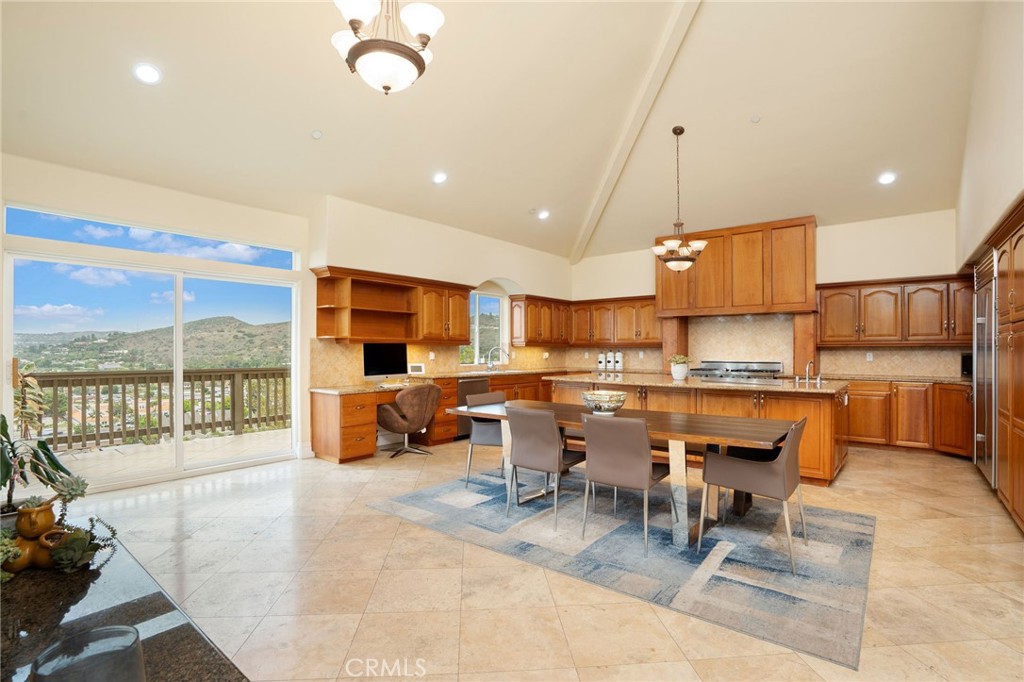 Perched high in the hills of prestigious Panorama Heights, this 4,330+ sq ft view home is a rare opportunity to own a North Tustin legacy property—now with a $150,000 price drop, making it the lowest price-per-square-foot home in the neighborhood at just $427/sqft! From Catalina Island to the Hollywood Sign, this home offers 180-degree unobstructed views that include Angels Stadium, Disneyland fireworks, the L.A. Port, and snow-capped mountains in the winter. It’s a front-row seat to Southern California's most iconic sights—every single day. This spacious 4-bedroom, 3.5-bathroom fixer has vaulted ceilings on every floor, massive picture windows, and expansive decks that take full advantage of the stunning backdrop. The main level offers an open living and dining space, a large kitchen ready for your design touch, and direct access to a 3-car garage. Plus, the oversized driveway offers space for up to 6 additional vehicles—rare in hillside communities like this. Downstairs, the primary suite feels like a retreat, with ample closet space, a sunken tub, separate shower, and direct access to another view deck. Two additional bedrooms and a full bath are just down the hall, along with a dedicated laundry room. The lowest level features a bonus room with a wet bar, wine cellar, guest bedroom, full bath, and separate entrance—perfect for an in-law suite, live-in nanny, or rental unit. Need even more space? There's an unfinished 1,179 sq ft area with plumbing, HVAC, and electrical already in place—ready for a gym, studio, home theater, or future ADU. Whether you're an investor/owner looking to add instant equity, a flipper hunting for your next high-ROI project, or a homeowner who wants to renovate their dream estate—this is the one. With great bones, a flexible layout, and jaw-dropping views, this is your chance to reimagine a North Tustin treasure. Just minutes from Peters Canyon trails, award-winning schools, and local dining hotspots. Don’t miss the opportunity to own in one of North Tustin’s most coveted view neighborhoods—with upside built in and price history on your side.