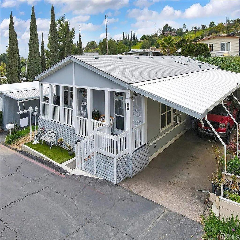 Welcome to the desirable all-ages Rancho Valley Park. This beautiful home offers an open concept floorplan of 1680 spacious sq ft, showcasing 3 bedrooms and 2 baths. The large kitchen offers ample counter space, large pantry, and newer appliances - wonderful for entertaining family and friends.Well maintained fenced backyard with fruit trees, fully remodel, Central AC and heat system, new water heater, outdoor storage, Three car covered parking. This park also offers the convenience of shopping, restaurants, coffee shops, and other amazing local amenities. Ranch Valley Park is located in an amazing community with features such as, RV parking, a refreshing pool, spa, and a clubhouse with billiards!