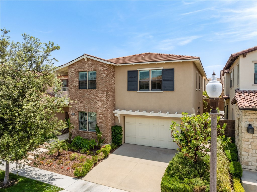 This elegant residence is located in the sought-after Eastwood Village community of Irvine and showcases tasteful upgrades with a spacious, functional layout. The home features a desirable downstairs guest suite with a private en-suite bathroom and walk-in closet, ideal for multigenerational living. The main kitchen offers an oversized center island, built-in double-door refrigerator, stainless steel appliances, 6-burner cooktop, large walk-in pantry, and a separate chef’s kitchen for added flexibility. Beautiful wood flooring spans the main level, while the upper floor is enhanced with upgraded plush carpeting. A versatile loft provides additional space that can serve as a media room, office, or play area. The luxurious primary suite is situated upstairs with scenic views and includes a spa-inspired bathroom with a soaking tub, walk-in shower, and custom-designed walk-in closet. A recently added California room extends the living space outdoors for year-round enjoyment. Residents of Eastwood Village enjoy resort-style amenities including pools, clubhouses, BBQ areas, tennis and basketball courts, soccer fields, playgrounds, and the scenic Jeffrey Open Space Trail. Conveniently located near shopping, highly regarded schools, and major freeways, this home offers the perfect blend of luxury, comfort, and convenience.