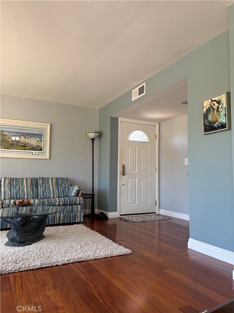 Fantastic location! Near the Coast Highway, beach access trail and downtown! Ground level, single story unit with spacious patio adjacent to a large lawn beside the pool and hot tub. Panoramic view of the hills and homes of San Clementeans well as golf course views. Beautiful wood flooring, ceiling fans, beveled glass sliders and other unique features and amenities make for gracious living or a comfortable getaway or investment property! This is something YOU MUST SEE to fully appreciate! It's the coolest condo ever!