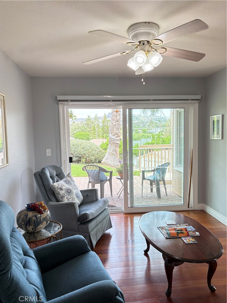 Fantastic location! Near the Coast Highway, beach access trail and downtown! Ground level, single story unit with spacious patio adjacent to a large lawn beside the pool and hot tub. Panoramic view of the hills and homes of San Clementeans well as golf course views. Beautiful wood flooring, ceiling fans, beveled glass sliders and other unique features and amenities make for gracious living or a comfortable getaway or investment property! This is something YOU MUST SEE to fully appreciate! It's the coolest condo ever!