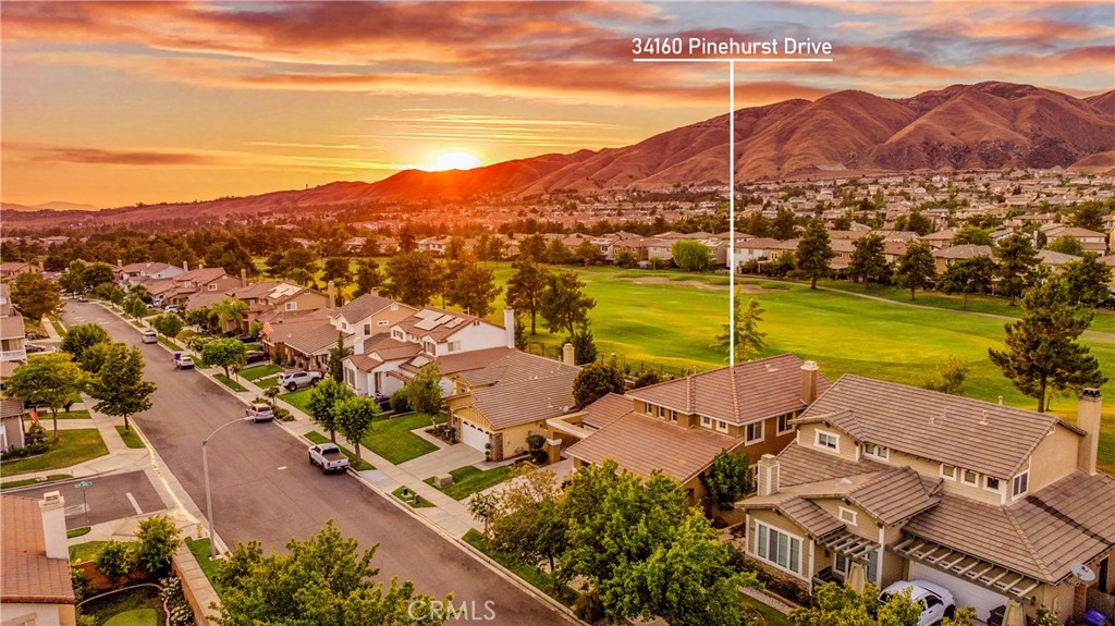 Welcome to this move-in ready 4-bedroom, 3-bath home with 2,406 SqFt of light-filled living space in Yucaipa’s popular Chapman Heights community -- just 5 minutes from Chapman Elementary! Sitting right along the fairway, this home offers gorgeous mountain and golf course views from inside and out. Inside, you'll find a spacious, modern, and flexible layout with recent paint, laminate wood flooring, and big dual-pane windows that let in tons of natural light. The formal dining room flows into a bright great room and an open kitchen with granite countertops, dark wood cabinetry, and plenty of storage. Downstairs includes a guest bedroom or home office with a full bath nearby, plus a separate laundry room for added convenience. Upstairs, the large primary suite features views, a soaking tub, dual sinks, a walk-in closet, and separate shower with more of those amazing views! Two additional bedrooms share a full dual-vanity bath, and there’s even extra hallway storage at the top of the stairs. Step outside to relax in the backyard with wrought iron fencing, where you can soak in those peaceful golf course and mountain views from the comfort of your own gazebo! As part of Chapman Heights, you’ll enjoy the Yucaipa Valley Golf Course, multi-use trails, playground, dog park, on-site staff, night patrol, community security and more -- all for a low HOA fee! You’re also close to shopping, schools, parks, and the 10 Freeway for easy commuting!