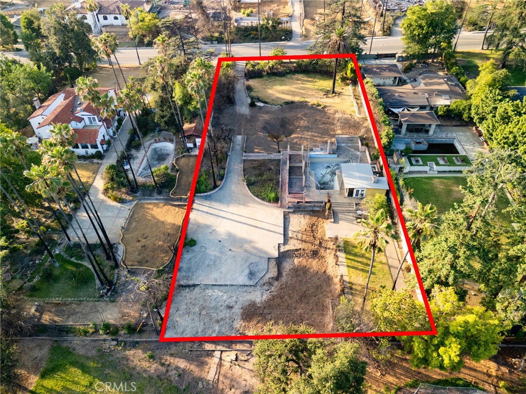 Situated in the heart of the highly sought-after Altadena Estate neighborhood, this expansive 120' x 269 sq.ft flat lot is nearly 3/4 of an acre, offering a unique opportunity to build your dream home in one of Altadena's most desirable enclaves. Nestled on a beautiful street just north of Mendocino and mere minutes from the Altadena Country Club and scenic hiking trails, the location blends luxury with nature. The property previously hosted a 4,368 sq. ft. residence that was lost in the Eaton Fire. Phase One of the development process has been completed, and the lot is now queued for Phase Two setting the stage for your custom build. This property is being sold as-is for land value only. There is a possibility for a lot split, buyers to verify with the city and is strongly encouraged to conduct their own due diligence regarding all aspects of the property, including remediation, building regulations, and permitted uses, with the County of Los Angeles and all relevant authorities. Don’t miss this rare chance to own a premium parcel in an elite Altadena neighborhood that's perfect for visionaries ready to create something truly special. Please Note: Drive by only. Do not walk the site. All those who chose to walk on the lot will be at their own risk. The lot contains debris and potential hazardous materials.