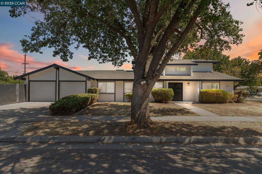 Fully Renovated and turnkey! As you step through the front door, you're greeted by a bright living room filled with natural light that's perfect for welcoming guests or enjoying a quiet morning. From there, the home transitions into a cozy family room and kitchen, where granite counters, new cabinets, appliances and a walk-in pantry create the heart of the home. Downstairs, three carpeted bedrooms and two living areas offer flexibility for family, guests, or a home office. Then retreat upstairs to your private primary suite, tucked away with a generous walk-in closet and updated bathroom; your own getaway at the end of the day. Step outside and enjoy a newly fenced backyard, ready for summer barbecues, play, or peaceful evenings under the stars. With new windows, flooring, paint, garage doors, and upgraded electrical, this home blends modern updates with thoughtful design truly move-in ready.