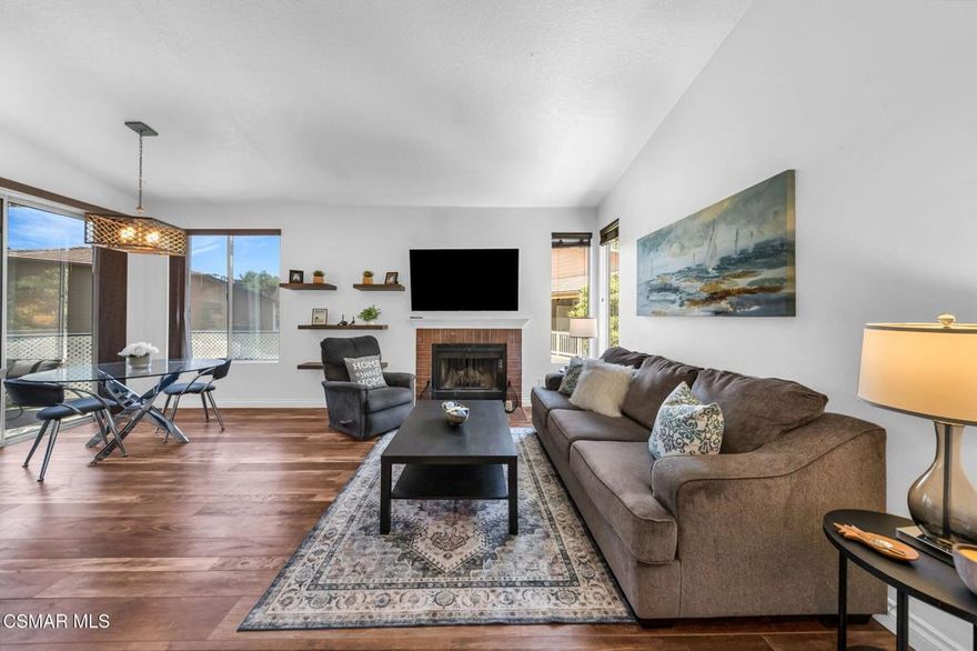 Great location! Gorgeously appointed 2 bedroom, 1 and 1/4 bath Camelot condo, centrally located in Thousand Oaks, blocks away from Gardens of the World, the Thousand Oaks Civic Arts Center, Mastro's Steakhouse and The Lakes Shopping Center. This unit is situated on the second level facing a quiet interior courtyard, surrounded by well-maintained grounds and trees, and conveniently close to the park, pool and spa.  As you enter, you'll immediately feel the warmth of this home and are greeted by vaulted ceilings, beautiful flooring and sparkling fixtures. The updated kitchen offers plenty of counter space and storage, plus a bar that seats 4. Rich wood-like flooring is throughout and provides an open flow to the bedrooms. The primary offers a custom arched walk-in closet . A slider door from the primary opens to the large wrap-around patio that can also be accessed from the living room. The shared bathroom offers separate vanities, on opposite ends of the bathroom. This unit also offers privacy, peek-a-boo mountain views and a newer HVAC system (2023). What a gem of a home! Camelot is an owner-occupied condo complex. HOA includes water, trash, and one covered assigned parking spot.