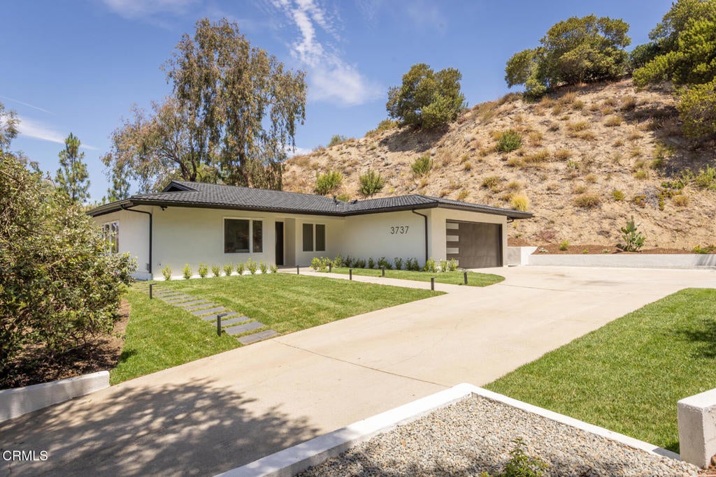 Photo of 3737 San Augustine Drive, Glendale, CA 91206 (MLS # P1-28253)