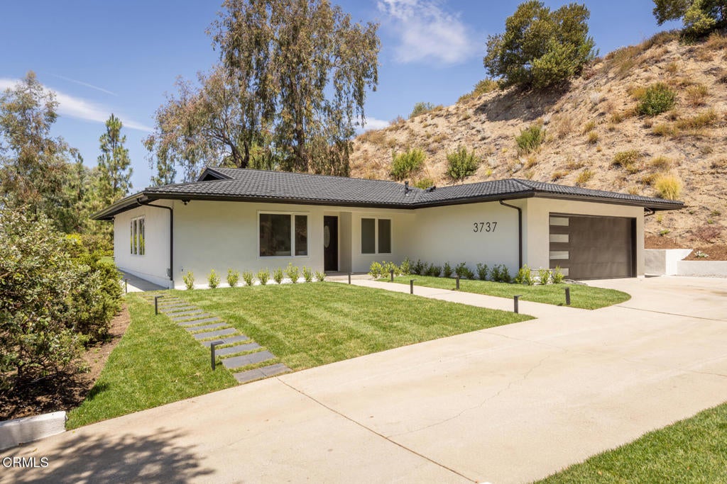 Photo of 3737 San Augustine Drive, Glendale, CA 91206 (MLS # P1-28253)