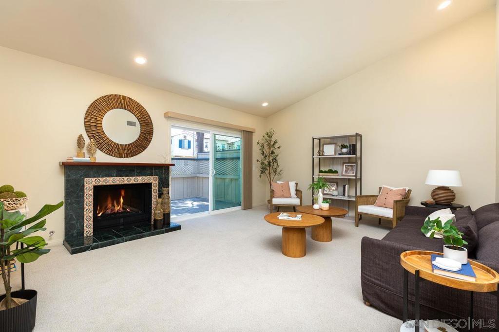 Seller Financing Offered! No points, no appraisal fee! This gorgeous, single-level, 2-bedroom, 2-bathroom townhome has been upgraded throughout with high end materials including: Uba tuba granite counters in dining room, kitchen and baths, Natural travertine flooring, New carpet, Serpentine marble and tile in both showers and the beautiful fireplace with custom Jarrah wood mantel, Custom tiled shuttered laundry in hallway (washer and dryer included), Cherry wood cabinets, Newer double paned windows and sliders, New stainless steel kitchen appliances, RO water system in sink, Painted two car garage with newly epoxied floor plus driveway space for 2 more cars, Three ceiling fans, Soundproofed common wall in living room with vaulted ceiling, Large, private patio off living room has natural gas outlet for your barbecue, Spacious primary bedroom has large, en suite bathroom, three closets and private patio. Quiet second bedroom would make an ideal WFH office. Step outside and take advantage of the community’s sparkling swimming pool and relaxing spa on a private circular road, all with a low monthly HOA fee. Discover comfort and convenience in this peaceful and warm townhouse located in the heart of San Marcos close to the 15, 78, Sprinter, Costco, CSUSM, Palomar College, markets, restaurants, etc. A rare turn-key opportunity with flexible seller financing—don’t miss your chance to own in one of San Marcos’ most desirable communities!