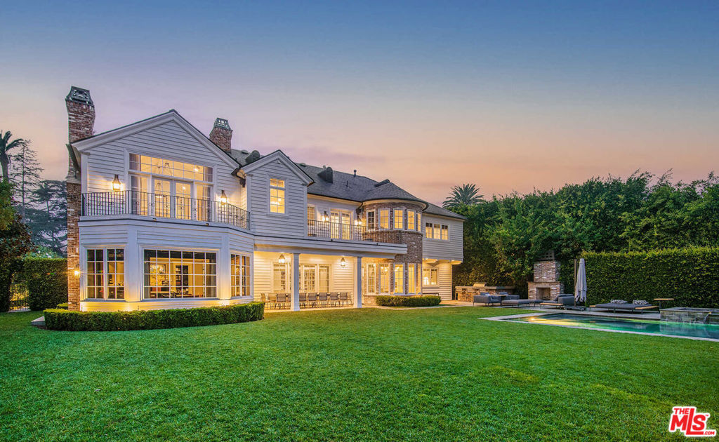 Located in prestigious Brentwood Park, this Traditional Ken Ungar home on a prime corner lot features the highest caliber of finishes, ample grounds and grand-scale living spaces that distinguish it among the neighborhood's finest homes. Enter into an oversized motor court into a three car garage. Through the front door a two story entry greets you, leading into a grand staircase, formal living and dining rooms on each side. A chef's kitchen complete with top-of-the-line appliances, all the imagined amenities and breakfast nook looks out into the expansive backyard. Upstairs includes a lounge area, playroom, and five guest bedrooms all including en-suite baths and large closets. The primary bedroom wing consists of spacious bathroom with dual sinks and massive closet. A sprawling yard with a pool and spa complete this magnificent estate.