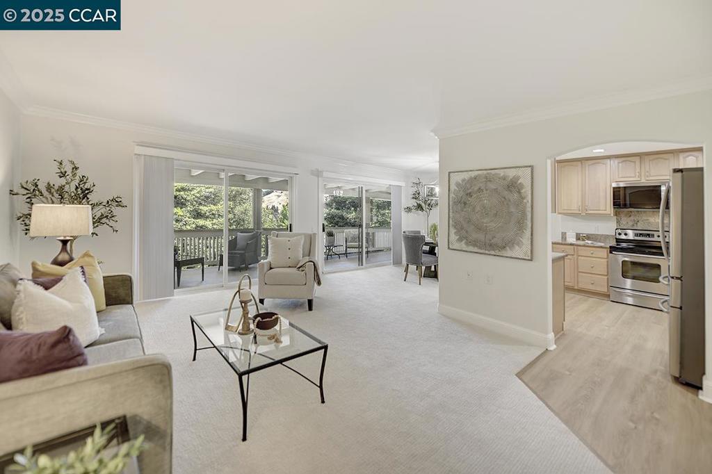 Stylish & Serene Sequoia Wrap — Enjoy the Rossmoor Lifestyle! Beautifully updated upper-end unit with a bright, open layout and charming wraparound deck—perfect for indoor/outdoor living. The kitchen features granite countertops, glass-front cabinetry, stainless steel appliances (including a new microwave), recessed lighting, and an open flow to the dining area, which enjoys natural light and views through a side window. Both bathrooms have been refreshed with modern vanities, updated lighting, and fixtures—guest bath includes a tub, while the primary offers a stall shower and ensuite vanity with generous closet space. Additional features include dual-pane windows, smooth ceilings with crown molding, plantation shutters in both bedrooms, newer interior doors and trim, fresh paint throughout, and in-unit washer/dryer. Close to carport parking for added convenience. Enjoy the unparalleled Rossmoor lifestyle: 6 clubhouses, 2 golf courses, fitness centers, tennis & pickleball courts, swimming pools, hiking trails, movie theater, hobby studios, restaurants, and an endless array of clubs and social activities. Resort-style living in a gated community—this is an opportunity not to be missed!