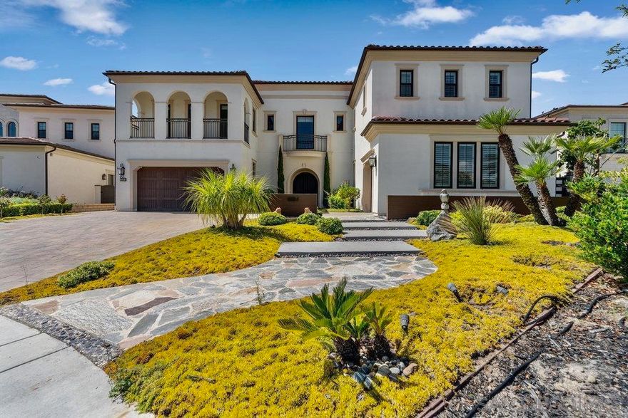 Nestled within the prestigious gated community of Palomar at Pacific Highlands Ranch at the end of a cul-de-sac, this stunning Toll Brothers estate offers over 6,000 sq. ft. of luxury living on a premium canyon lot with breathtaking, unobstructed views. Designed for both elegance and comfort, the home features 5 spacious bedrooms plus a private office. The grand foyer welcomes you with soaring ceilings, setting the stage for the impressive interiors. At the heart of the home, the chef’s kitchen boasts dual islands, high-end stainless-steel appliances, and seamless flow into the expansive family room—perfect for entertaining. The main level also includes a sophisticated office with custom built-ins and a private ensuite bedroom. Upstairs, the primary suite is a true retreat, complete with a private balcony overlooking the panoramic mountain and golf course. The primary bath offers a freestanding tub, oversized walk-in shower, and two custom walk-in closets. Three additional ensuite bedrooms and a generous loft complete the upper level. The outdoor living space is equally impressive, featuring a full outdoor kitchen, expansive turf play areas, and unmatched privacy. Additional highlights include a 3-car garage, large driveway, and an oversized lot designed for both relaxation and entertaining. Located just minutes from premier shopping, dining, and within the highly acclaimed San Dieguito Union School District, this home offers the perfect balance of luxury and convenience.