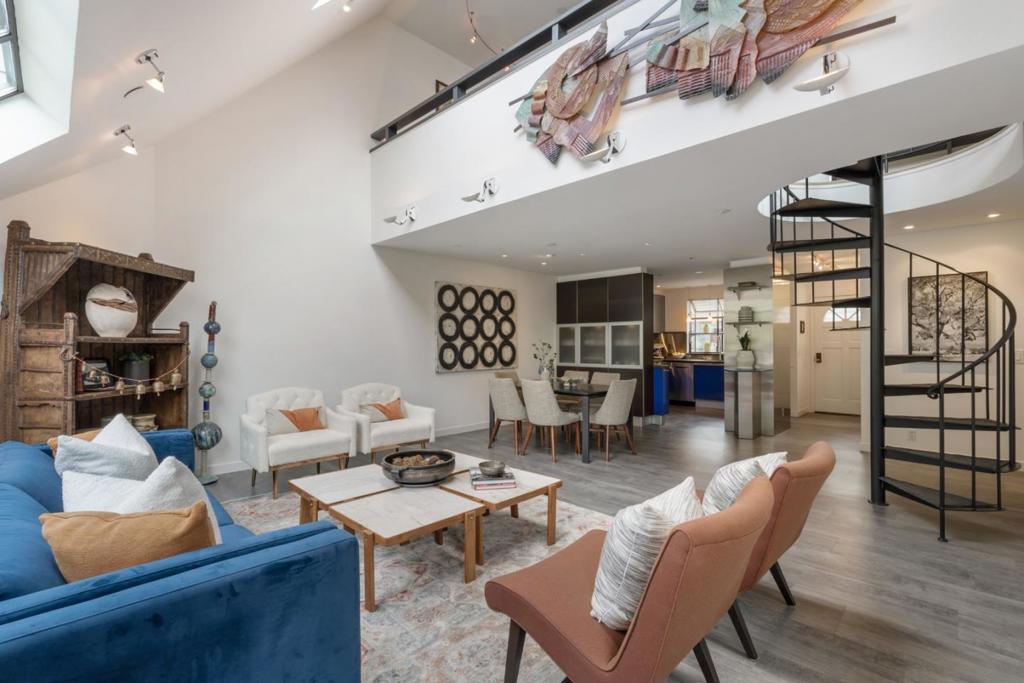 Dramatic downtown Palo Alto condo offering sophisticated living in a rare solarium-style building of just 12 units. This light-filled home features 3 bedrooms including loft space that can serve as a family room, office, or guest bedroom. Vaulted ceilings, a roof deck, and a balcony create a bright, open atmosphere. The custom Italian Dream Blue Snaidero kitchen showcases concrete counters and premium stainless-steel appliances, featuring a 4-burner gas Gaggenau cooktop with grill and a Miele convection ovenseamlessly blending style and function. Remodeled bathrooms, radiant heated floors, custom closets, and thoughtful storage maximize convenience. Enjoy in-unit laundry, two parking spaces with EV charger, and two storage units. As an added bonus, the complex includes two guest suites for visiting family and friends. Located close to Stanford University and top-rated Palo Alto schools, this residence combines modern design with unmatched location. HOA dues include hot water and heating.