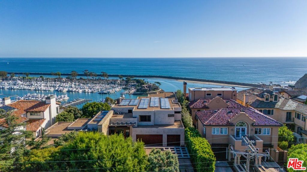 This architectural masterpiece boasts panoramic Ocean views situated on the coastal bluff above Dana Point Harbor. This rare bluff front property sits on a doublewide lot, which allowed the architect to optimize the oceanfront views from almost every inch of the home. The expansive glass gives it an effortless indoor outdoor living feel. The home is a true architectural gem that has earned prestigious accolades from The American Institute of Architects and the Orange County Museum of Art. The exterior is thoughtfully constructed with premium materials like Santa Barbara Sandstone, copper-clad arbors, mahogany lattice gates, and limestone walls. Trees and waterfalls adorn the luxury dipping pool and jacuzzi for an intimate and private experience while still allowing for breathtaking views of the harbor. The location of this home is ideally situated in the heart of Dana Point in the Lantern District with walkability to premium shops, dining, and the soon to be newly renovated Dana Point Harbor. The grand redevelopment plan of the harbor continues to build on the luxury living and walkability of this community providing astute buyers a significant opportunity.