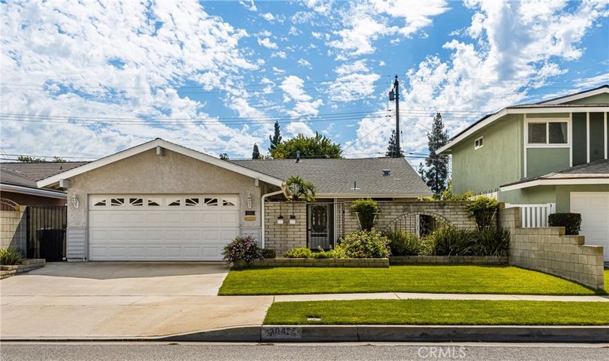 Tremendous opportunity in Lakewood!  Charming single story home with great curb appeal and location in wonderful Lakewood neighborhood!  This beautiful home has entry through an enchanting courtyard and offers a spacious floorplan with 4 bedrooms/1.75 bathrooms, living room with cozy fireplace and adjacent dining area, and delightful kitchen with breakfast bar that opens up to the dining and living areas.  This meticulously maintained home offers upgraded windows, beautiful glass entry door, charming French doors, stunning French sliding glass door, newer heating and central air conditioning (just installed this summer!), newer roof, and central vacume system.   The outdoor living is ideal for entertaining with a covered patio, as well as an enclosed patio with handsome wood beam ceiling, and backyard with green grassy area.  There is also a drywalled 2 car garage with an upgraded garage door.  This home is conveniently located to freeways, Rynerson park, dog park, and shopping/restaurants.  All of this and so much more including the Blue Ribbon School of Artesia High School!