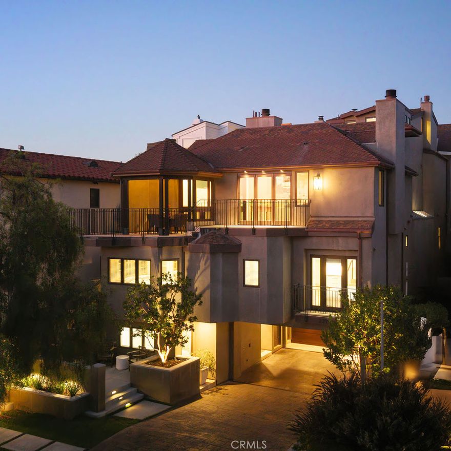 This distinctive custom home has been recently completed with an extensive retrofit and expansion offering a rare and singular opportunity in Corona del Mar.  The home is set upon an elevated lot offering nearly 50-feet of frontage with a prized southwest orientation, delivering views of the Pacific Ocean, Newport Harbor, and year-round sunsets.  The property is defined by its substantial footprint, featuring a primary residence with 5 generous bedrooms and 5 bathrooms. For optimum versatility and privacy, a detached two-bedroom, two-bathroom guesthouse provides a self-contained residence for guests or multi-generational living.  In total, both properties provide over 5,000 square feet of interior space.  A rare opportunity in Corona del Mar.

The personalized design is a study in functionality and refined attention to detail, showcasing a rich palette of materials that emphasize texture and light. Architectural details include smooth stucco finishes, clean lines, various stone, and warm accents of exposed white oak beams throughout the interiors.  The heart of the main home is the modern kitchen design, featuring a minimalist aesthetic, exclusive fixtures, and an open layout perfect for both daily life and entertaining.  The coastal lifestyle is achieved through abundant indoor-outdoor living.  The boundary is dissolved between the interior living spaces and the exterior terraces. Multiple outdoor areas, enhanced by thoughtful lighting and fireplaces, invite year-round enjoyment.  A private elevator provides transit across three levels of the primary residence. The Primary Suite is dedicated to tranquility and privacy offering a spa-inspired retreat.

Practical living is further enhanced by ample parking—a prized find in Corona del Mar—ensuring convenience for both residents and guests.  The home's location is perfectly located to all of what Corona del Mar has to offer.  There is no other property like this in all of Corona del Mar.
