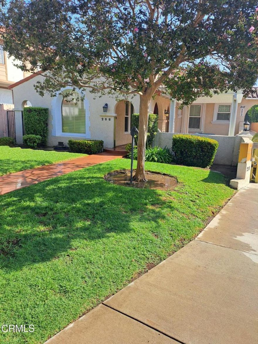 This immaculate home with Spanish Revival architecture has amazing curb appeal.  Complemented with a Red tile Roof, round windows and doorways.  The enchanting front yard has a private courtyard area.   The inside is remodeled with perfection.  Entry hall has  curved doorways and wood moldings.Living room has a large curved bay window, original built-in bookshelves , a tiled fireplace large wood moldings and beamed ceilings. Remodeled  Kitchen has wood cabinetry with Granite countertops, breakfast bar, recessed lighting and appliances. Remodeled tiled full bathroom with wood cabinetry, tub and separate shower stall with glass enclosure. Three large bedrooms with large closets.  Second remodeled bathroom is tiled. Upgraded double pained windows and Plantation shutters throughout. Upgraded wood flooring and central air & Heat throughout. Two car garage with a garage door opener. If you like all the finest amenities in your home ?  This is the home for you!