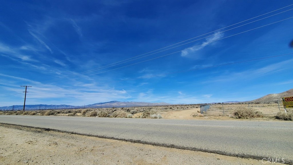 Perfect site for your custom estate in West Rosamond with views stretching clear across the valley. 4.89 acres fronting paved Rosamond Blvd with electric available at the street. Plenty of room for your animals and toys. A great homesite! *Buyer to make their own independent investigations regarding Zoning & General Plan Designations, Environmental and Hazard Zones, Access and Development costs, Availability & Costs of utilities.