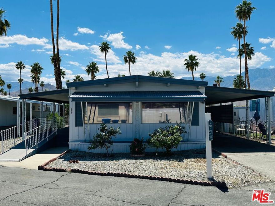 Offered fully furnished & turn-key, this meticulously maintained home is move-in ready! Featuring 1,000 square feet of living space, including 2 bedrooms & 2 bathrooms, this super clean mobile home in pet-friendly Royal Palms is the one you've been waiting for! Upgraded where it counts, yet maintaining just the right amount of original charm, the home features a massive great room with grand picture windows, a dedicated dining area, an adorable kitchen with breakfast bar, indoor laundry, partially upgraded primary bath, a large walk-in closet, clever built-ins, upgraded flooring, central HVAC, a large elevated deck, carport, a storage / garden shed, a special-built work shop (with full power, refrigerator, and room for a golf cart), plenty of yard space, and more... The community has many outstanding amenities, including two shuffle board courts, four pickle ball courts, a clubhouse, community pool & spa, fitness center, putting green, 2 dog parks, and more! This one has it all! With a low monthly lot rent of just $895 that includes sewer and trash, this one won't last! Schedule your tour today! Royal Palms is a 55+ community.
