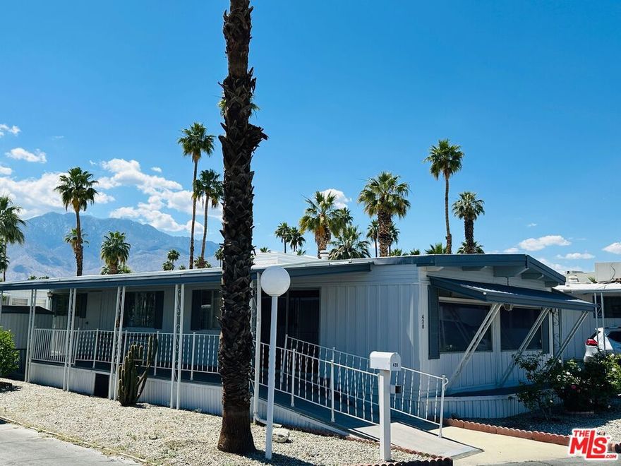 Offered fully furnished & turn-key, this meticulously maintained home is move-in ready! Featuring 1,000 square feet of living space, including 2 bedrooms & 2 bathrooms, this super clean mobile home in pet-friendly Royal Palms is the one you've been waiting for! Upgraded where it counts, yet maintaining just the right amount of original charm, the home features a massive great room with grand picture windows, a dedicated dining area, an adorable kitchen with breakfast bar, indoor laundry, partially upgraded primary bath, a large walk-in closet, clever built-ins, upgraded flooring, central HVAC, a large elevated deck, carport, a storage / garden shed, a special-built work shop (with full power, refrigerator, and room for a golf cart), plenty of yard space, and more... The community has many outstanding amenities, including two shuffle board courts, four pickle ball courts, a clubhouse, community pool & spa, fitness center, putting green, 2 dog parks, and more! This one has it all! With a low monthly lot rent of just $895 that includes sewer and trash, this one won't last! Schedule your tour today! Royal Palms is a 55+ community.
