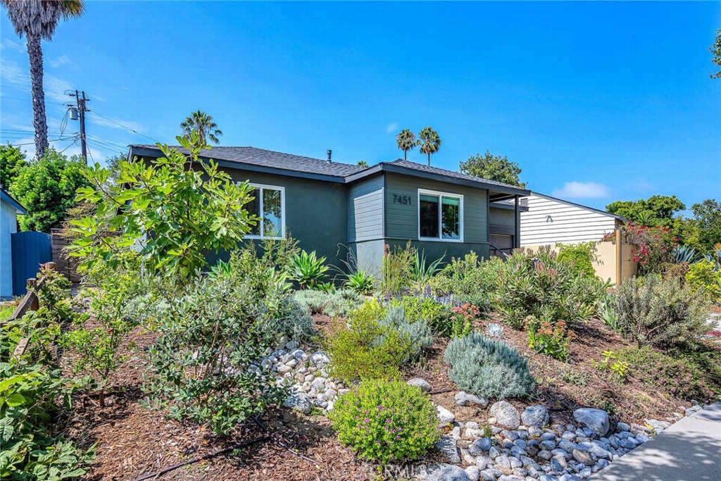 Discover 7451 Midfield Ave, a reimagined Mid-Century Transitional bungalow in Westchester’s coveted Osage neighborhood. Over $100K was invested in landscaping, creating a private outdoor retreat with a pergola draped in grapevines producing table grapes, a tranquil fountain, a separate sitting area, and a private orchard with multiple fruit trees including a clementine—perfect for kids or homemade marmalade. The yard is alive with monarch butterflies and hummingbirds and includes a dedicated dog run. Inside, the 3 bed/2 bath home features newer engineered white oak floors, designer fixtures, and a chef’s kitchen with Calcutta Quartz counters, herringbone backsplash, custom cabinetry, and stainless appliances. The primary suite offers dual closets (one walk-in) and a spa-like en suite. Additional upgrades include Tesla PowerShare, EV charger, Starlink, garage gym with optional sauna & cold plunge, newer roof, newer HVAC with A/C and Nest thermostat, and more. With easy access to the 405 and all the best of West LA, this move-in-ready property combines modern amenities, outdoor living, and chic design—a rare opportunity in one of the neighborhood’s most desirable pockets.