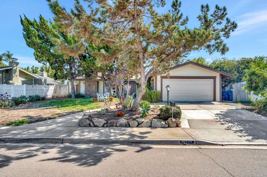 Welcome to single-level living in La Mesa! This 4BR/2BA home sits on a generous 10,600 sf lot in a quiet neighborhood setting. The living room features a striking stone fireplace and beam accents, creating a warm focal point. The updated kitchen offers granite counters, stainless appliances, and a breakfast bar that flows into the dining area with easy backyard access. Step outside to enjoy a covered patio, sparkling pool with slide, and backyard views of the mountains—perfect for entertaining or relaxing with amazing sunrises. The master bedroom includes backyard access and direct connection to the pool area, blending indoor and outdoor living.   Additional perks: owned solar (paid off), upgraded central A/C, a new water heater (2023), dual-pane windows throughout, and an attached 2-car garage. Convenient to Mt. Helix amenities and freeway access. Buyer to verify all.