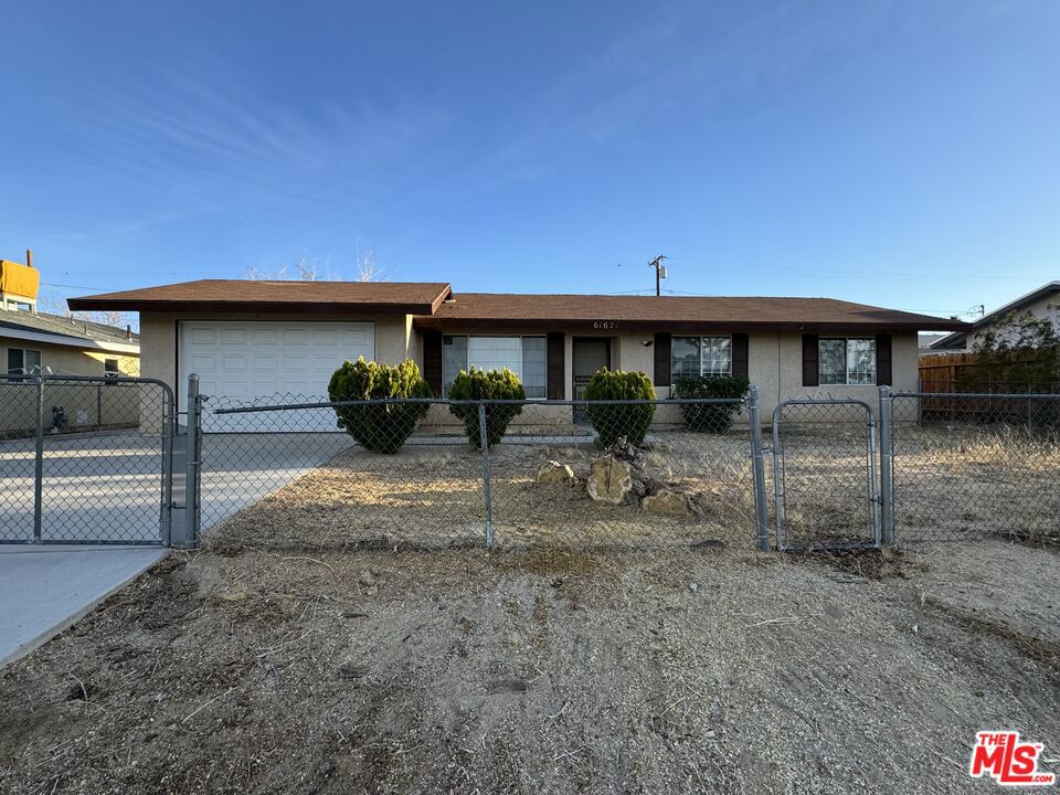 Welcome to 61627 Capilla Drive, a charming 3-bedroom, 1-bath single-story home in the heart of Joshua Tree. Built in 1988 and set on an 8,755 sq ft lot, this home offers comfort, simplicity, and endless desert potential. The light-filled interior features a functional layout with a cozy living area, spacious kitchen, and three versatile bedrooms, perfect for a primary residence, vacation home, or income property. The full bathroom is ready for your personal touch. Outside, enjoy a fully fenced yard with mountain views, open skies, and space to create your dream outdoor oasisideal for entertaining, stargazing, or future additions. Just minutes from Joshua Tree National Park, local shops, and cafes, this home offers the best of desert living. With no HOA and low taxes, it's a perfect opportunity to own in one of Southern California's most iconic communities. Don't miss your chanceschedule a tour today!