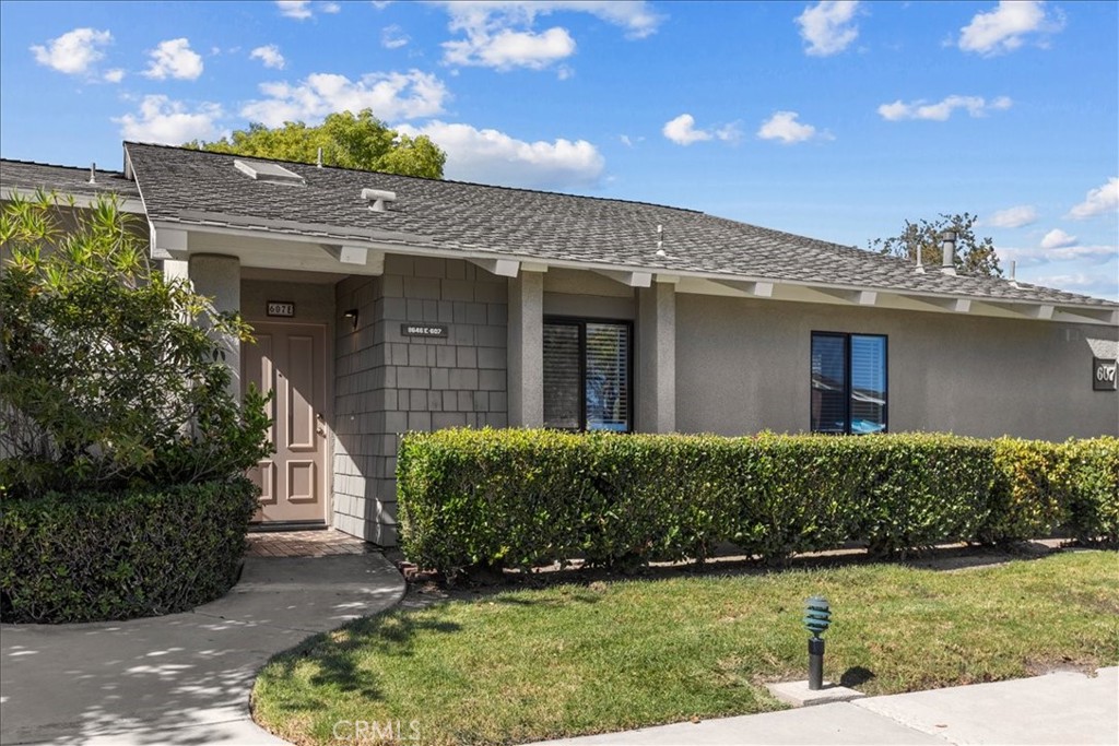 Welcome to this single-level end-unit Laguna model in the vibrant 55+ community of Huntington Landmark. Recently refreshed, this home features a bright great room with vaulted ceilings, a skylight, luxury vinyl plank flooring, custom baseboards, and fresh paint. The original third bedroom has been opened to create a spacious, open-concept layout that seamlessly connects the living room, breakfast nook, built-in buffet/bar, and formal dining area. The kitchen stands out with Quartz countertops, white shaker soft-close cabinetry, stainless steel appliances, a deep stainless sink, and recessed LED lighting—all open to the living room for ease of entertaining and everyday living. Both bedrooms offer plantation shutters and ceiling fans. The primary suite includes a spacious walk-in closet and a bathroom with a skylight, dual Quartz vanities, a sit-down makeup area, and a tub/shower combo. Laundry is conveniently located in a patio closet with space for full-size appliances. A nearby single-car garage and convenient guest parking add to the home’s functionality. Huntington Landmark residents enjoy 24-hour guard-gated security, a resort-style clubhouse, pools, spa, tennis, pickleball, shuffleboard, fitness center, billiards, library, craft and game rooms, woodshop, putting green, and a wide variety of social and recreational opportunities. Ideally situated near the beach, shopping, dining, and the post office, this home offers a blend of comfort, convenience, and coastal living.