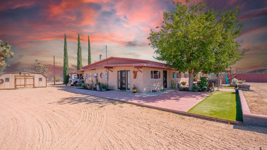 Desert Oasis with 5 Acres, Solar & Equestrian Potential!If you're looking for a horse property with incredible potential or a wonderful desert home surrounded by wide-open space and breathtaking mountain views, look no further! This wonderful single-story desert oasis sits on a sprawling 5-acre lot and offers fully paid SOLAR power, a BONUS ROOM, and countless upgrades inside and out.Step inside to a warm and welcoming living room centered around a wood-burning stove, perfect for cozy desert evenings. The space opens seamlessly to a spacious chef's kitchen, featuring abundant cabinetry and counter space, double ovens, a sleek range top, custom tile backsplash, modern pendant lighting, and a dishwasher for everyday convenience. Just off the kitchen sits a well-appointed laundry room with additional storage cabinetry. A versatile bonus room connects to the carport, offering the ideal setup for a mudroom, creative studio, home gym, or office -- the possibilities are endless.The primary suite features a spacious walk-in closet with vanity area and an en-suite bath with dual sinks and an updated shower. The guest bedroom is generously sized, ideal for family or visitors.Step outside and discover endless possibilities on this expansive, flat and usable 5-acre lot -- ideal for horses, recreation, or future expansion. There's ample space to design your dream equestrian setup, with room for a large arena, round pen, barn, corrals, and more. The property also features a fenced area ready for an above-ground pool and a patio perfect for soaking up the sun or watching the kids play. After a long day, unwind in the spa beneath the starry desert sky, relax on the patio, or entertain guests while taking in the tranquil desert landscape and sweeping mountain views.Additional highlights include:Fully owned solar system for energy efficiencyNew mini-split system and swamp cooler -- very economicalNewer carpet with extra padding and newer subfloor in kitchenFreshly painted interior400 sq. ft. ''Man Cave'' / workshopTwo metal containers with roll-up doors used as horse shelters, adjoining an 18x20 covered shelter (ideal for box stalls)Dog run and so much more. Buyer to verify and perform their own due diligence regarding all aspects of the property, including but not limited to permits, usage, zoning, and square footage. Agent and/or seller make no warranties, representations, or guarantees regarding the information provided.